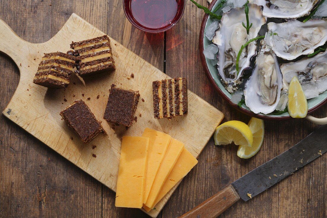 Pumpernickel with cheddar, oysters and lemons