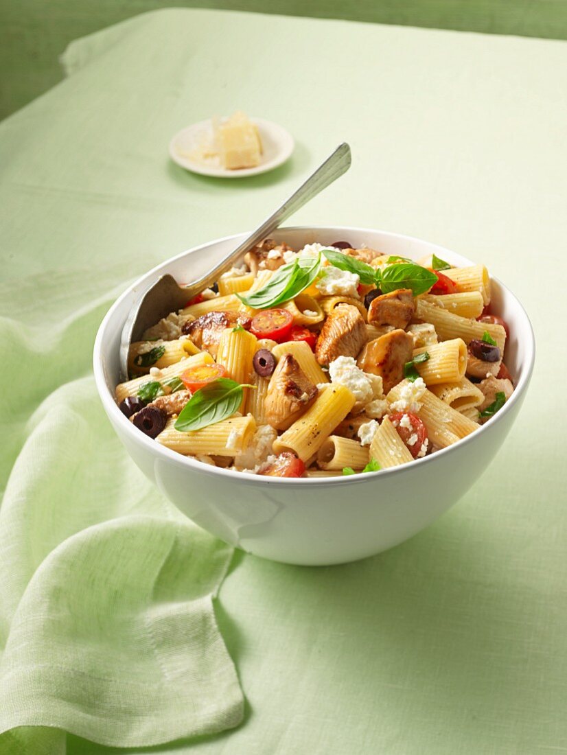 Pasta with turkey, olives, tomatoes and sheep's cheese