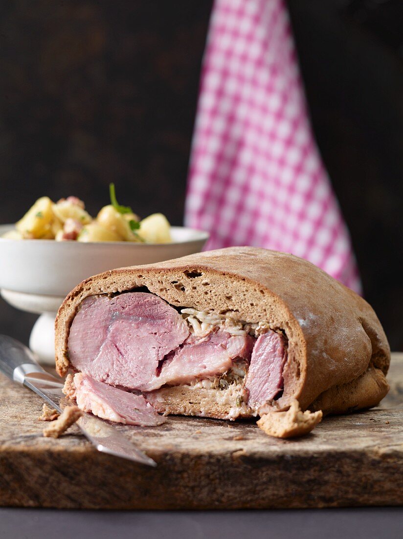 Shoulder of pork in bread dough