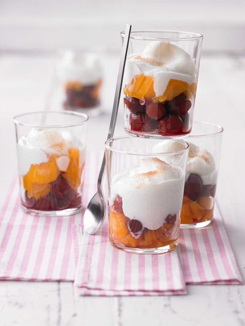 Quick layered deserts with cherries, peaches and cream