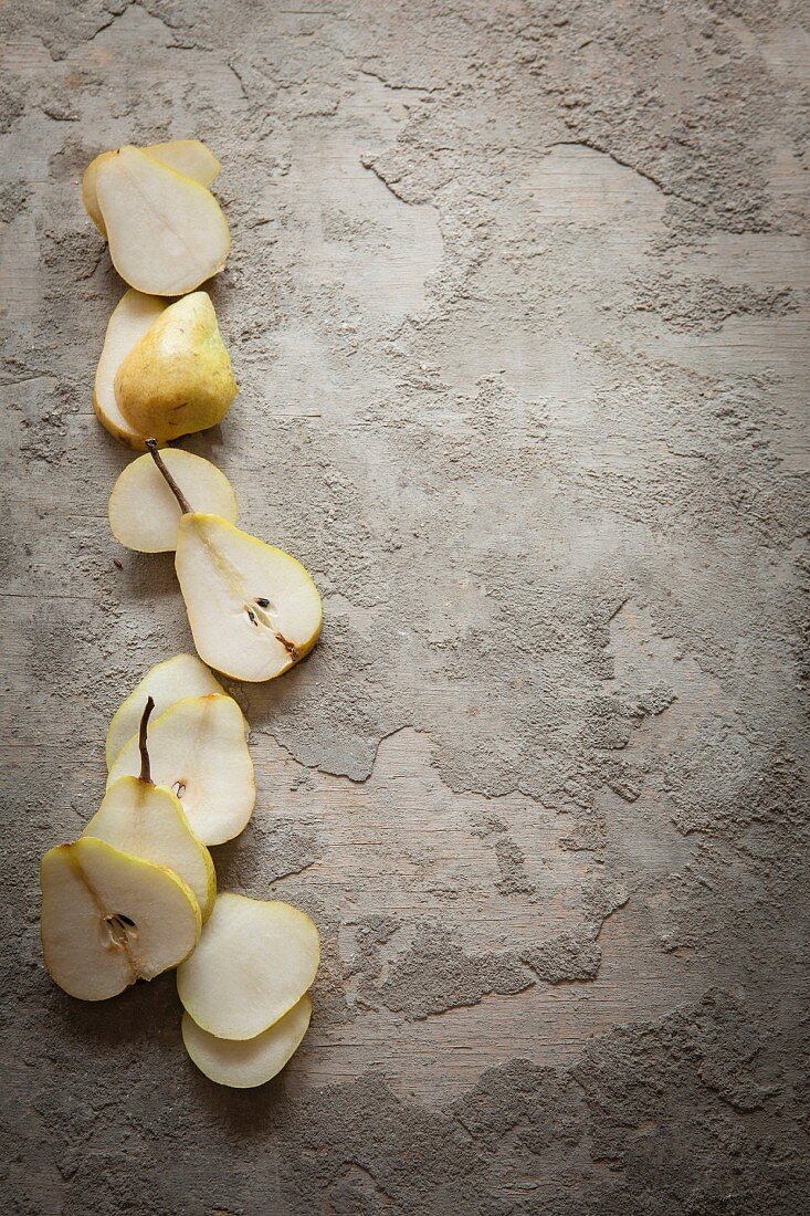 Sliced pears on a grey surface