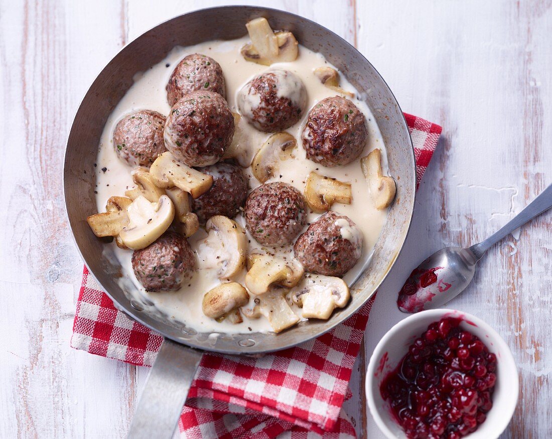 Köttbullar (Swedish meatballs) with a creamy mushroom sauce and lingonberries