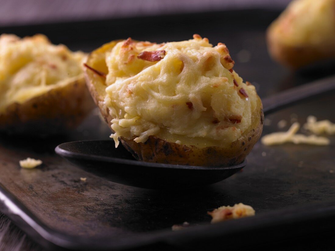 Oven baked potatoes topped with cheese