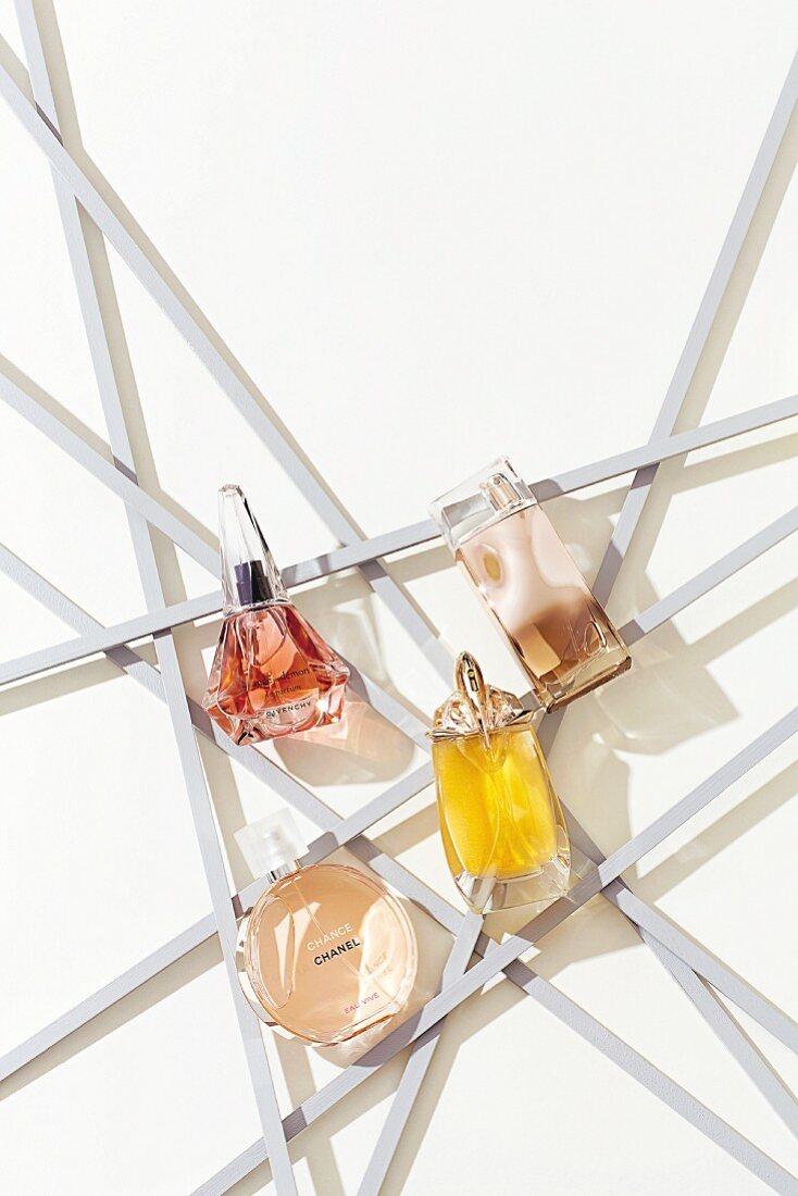 Four elegantly shaped bottles of perfume