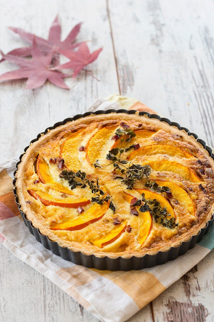 Pumpkin quiche with bacon, Parmesan and oregano