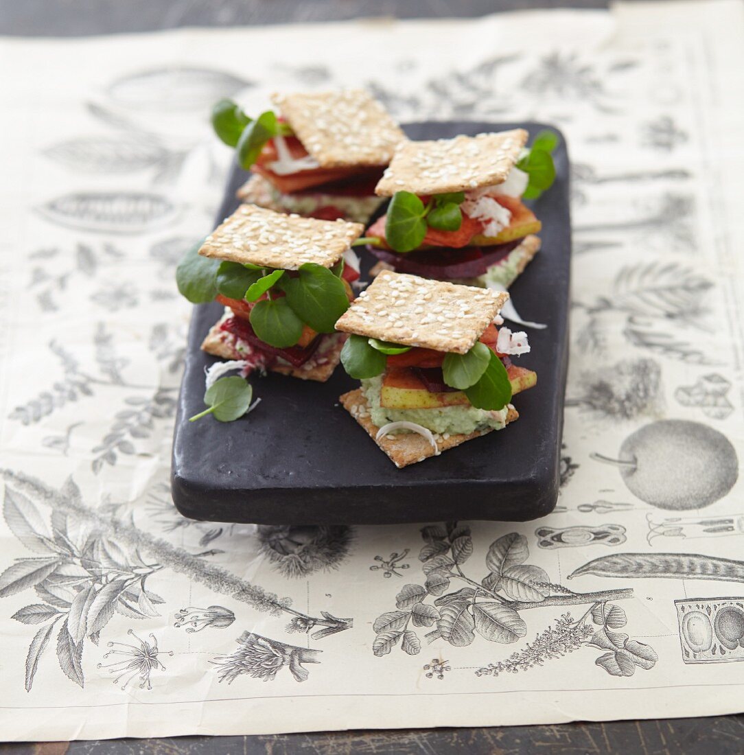 A cracker sandwich with watercress, pears and beetroot
