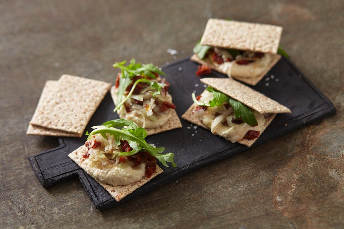 Cracker sandwiches with vegan cashew cheese cream and fresh kohlrabi