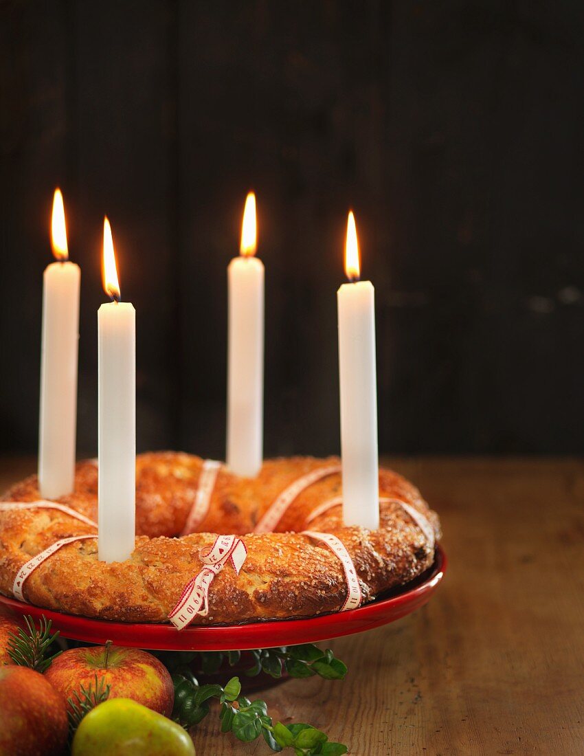 A Christmas advent wreath cake with candles