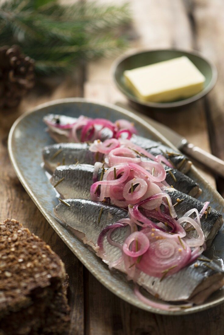 Pickled herring with red onions, butter and wholemeal bread