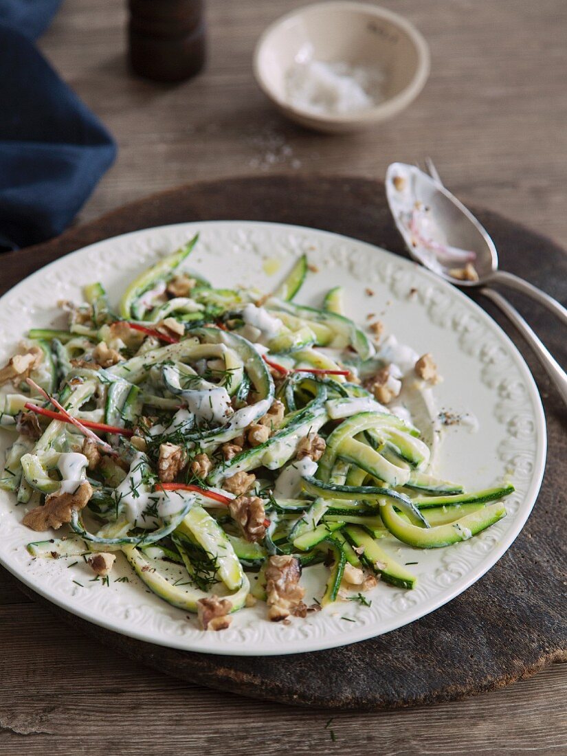 Vegan courgette salad with walnuts, chilli and soya yoghurt