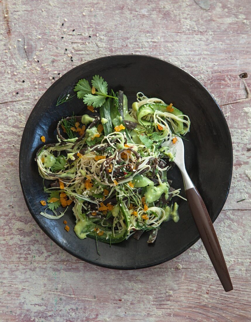 Vegan cucumber and avocado salad with algae pasta