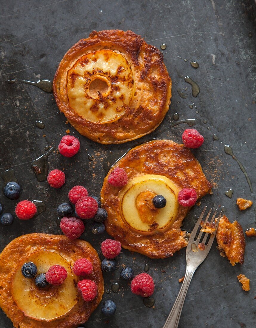 Vegan sweet potato pancakes with apples and maple syrup