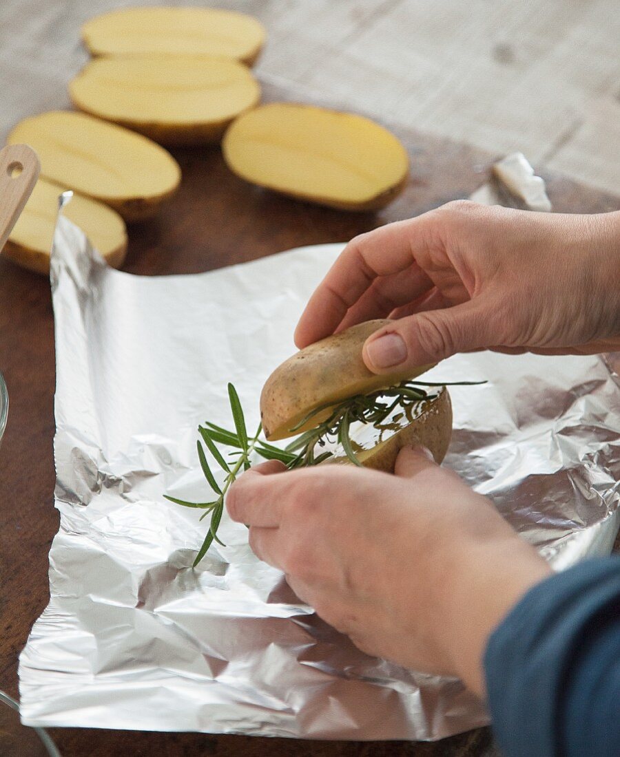 Rosemary potatoes being prepared for grilling