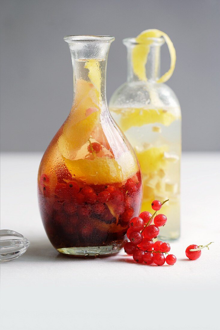 Homemade redcurrant and ginger liqueur and ginger and lemon liqueur