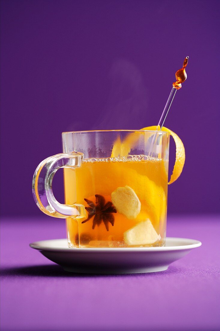 Homemade ginger punch with white wine, oranges and star anise