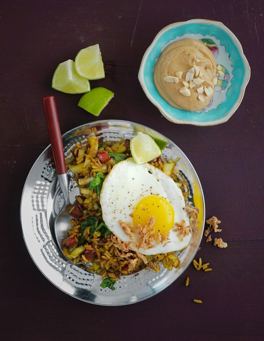 Vegetarian nasi goreng with egg and peanut sauce (Indonesia)