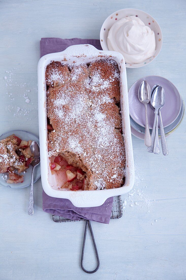 Apple cobbler with cinnamon and hazelnuts and eggnog cream