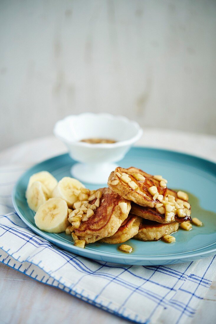 Mini banana pancakes with maple syrup