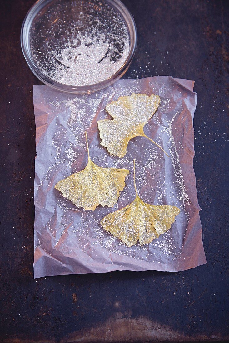 Gingko leaves sprinkled with fine, silver glitter