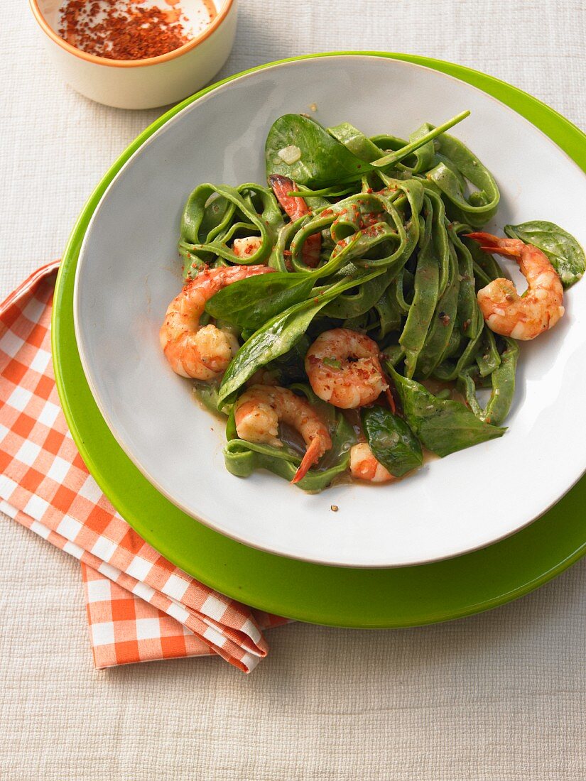 Grass green pasta with spinach and prawns
