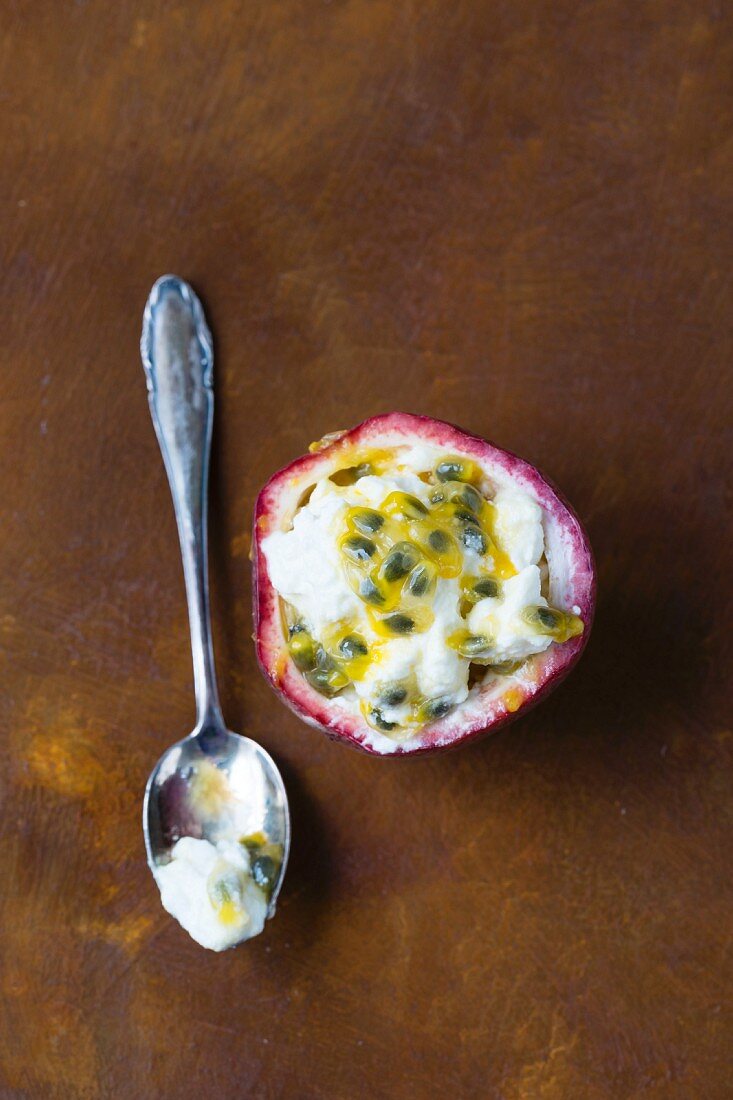 Turkish yoghurt with passion fruit served in a passion fruit shell