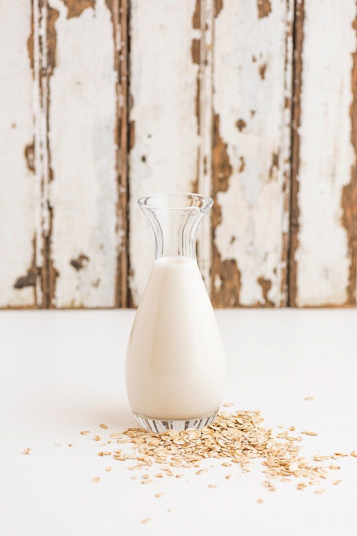 Oats and a bottle of oat milk