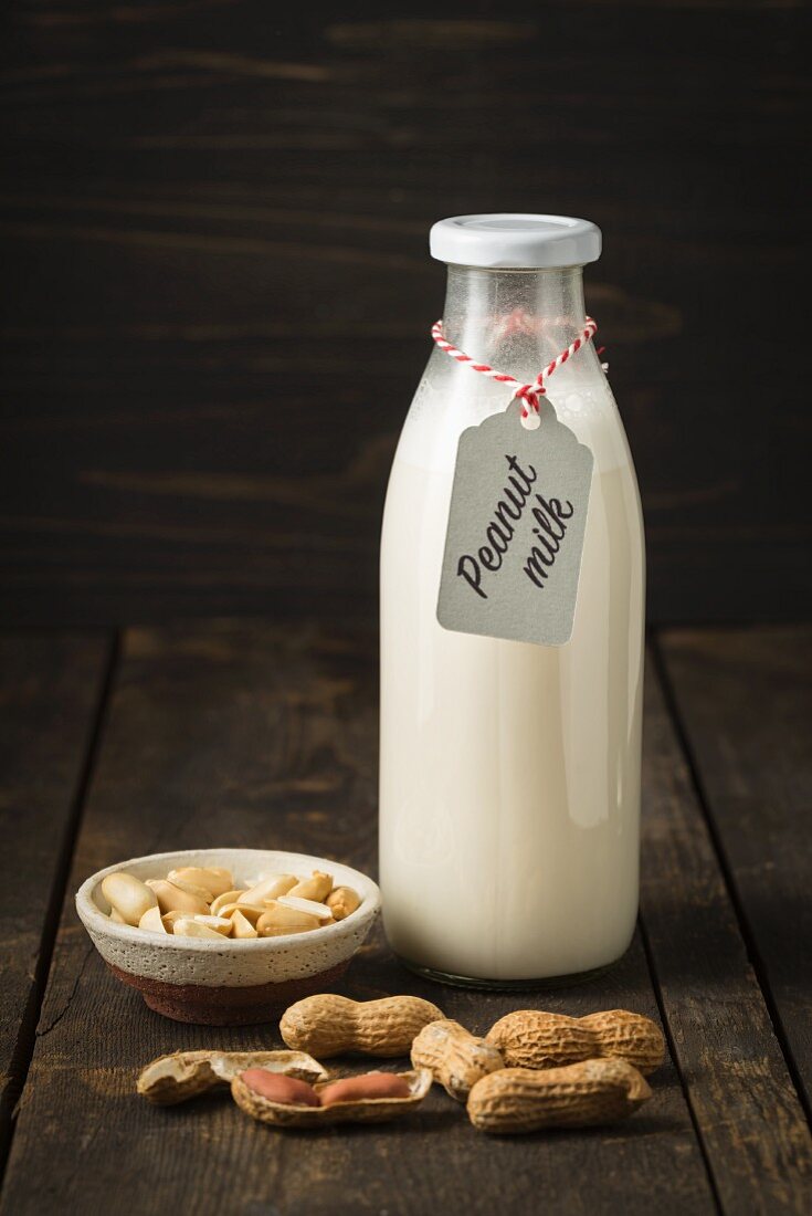 Peanut milk in a glass bottle with a label