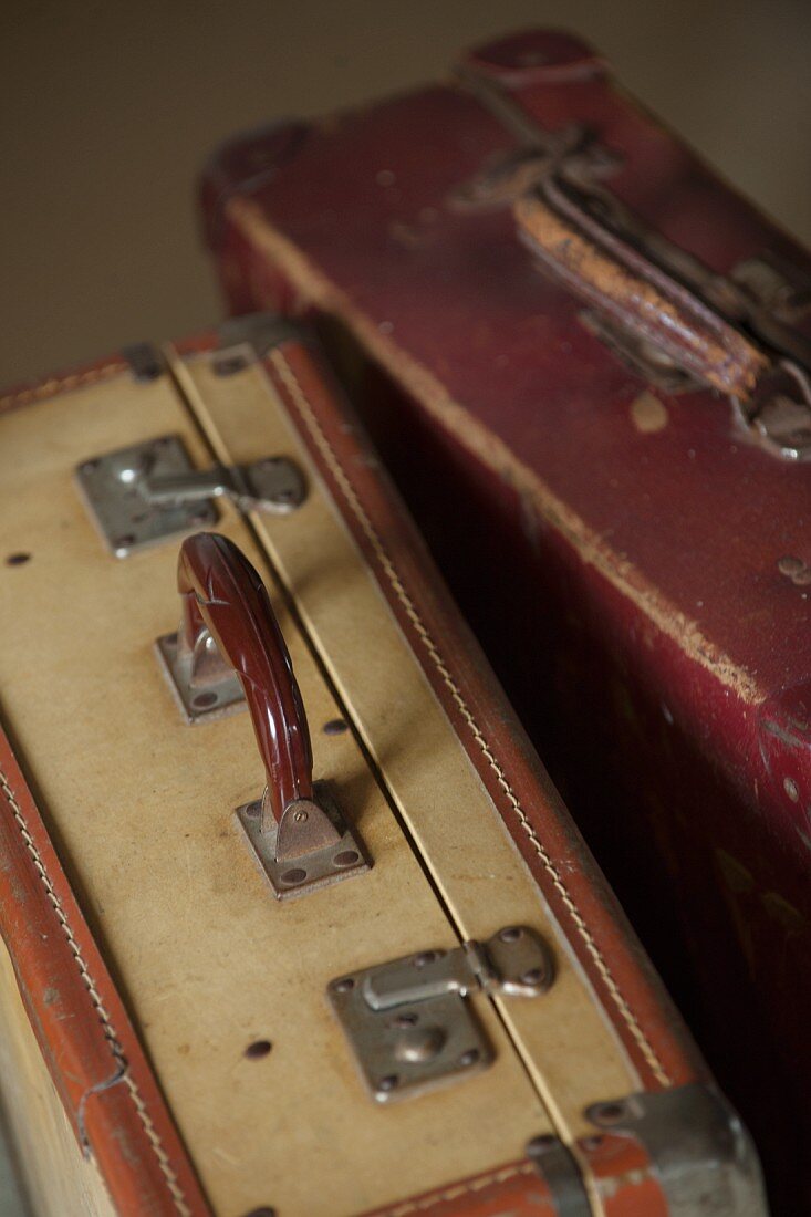 Two vintage leather suitcases