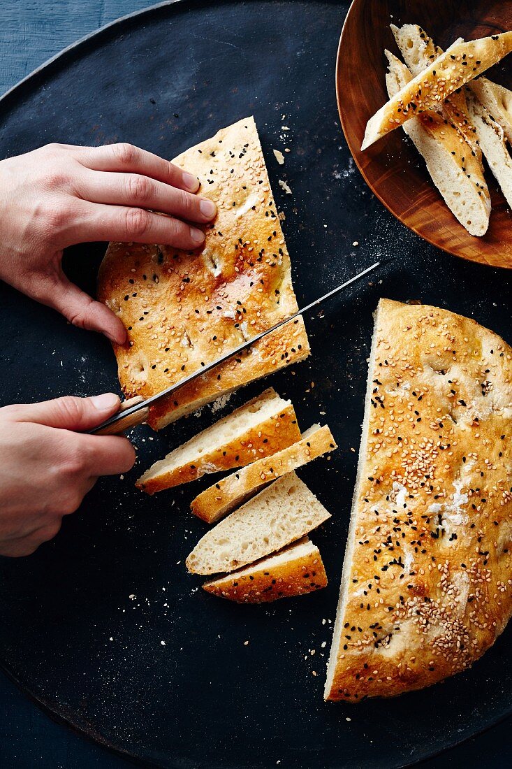 Homemade Turkish unleavened bread being sliced