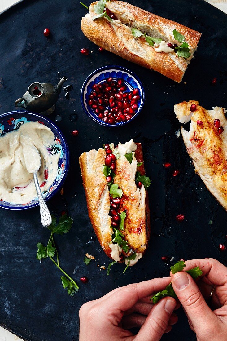 Galata trout rolls with tahini sauce and pomegranate seeds (Turkey)