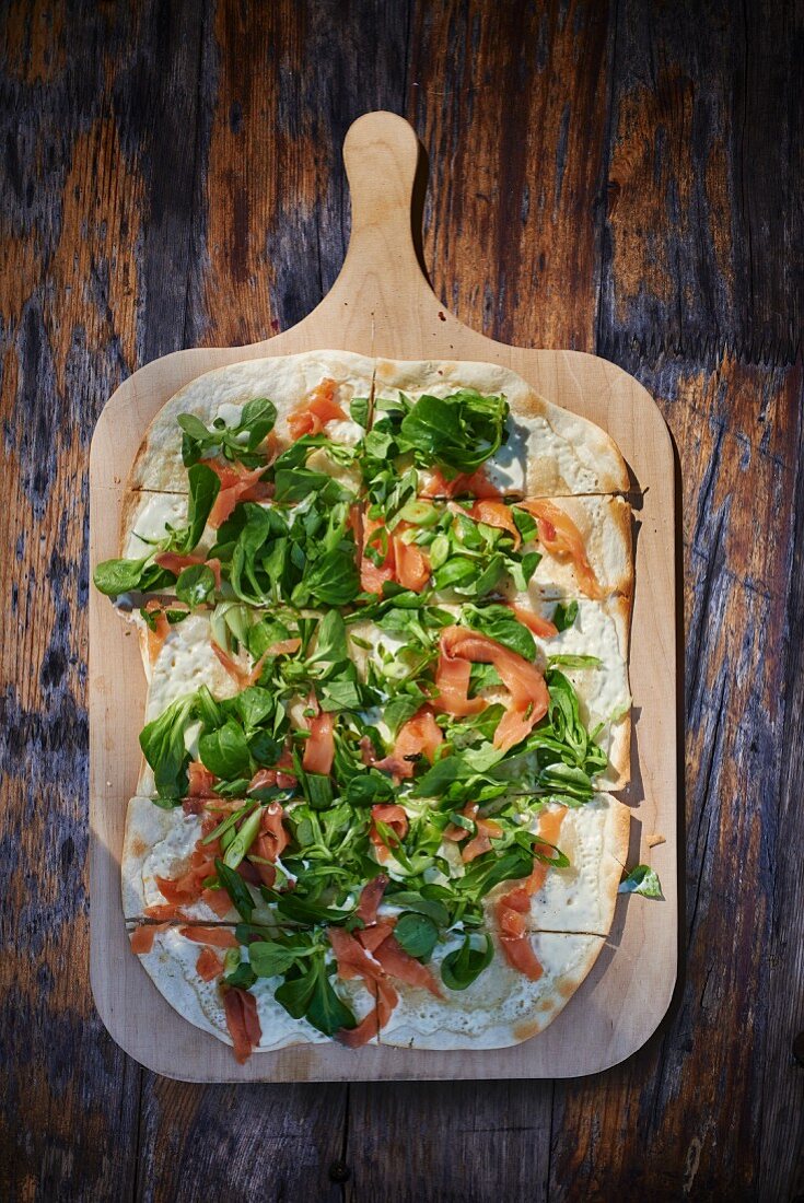 Tarte flambée with smoked salmon and lamb's lettuce