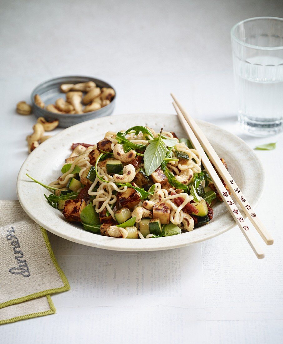 Stir-fried Mediterranean noodles with halloumi, cashew nuts and courgette
