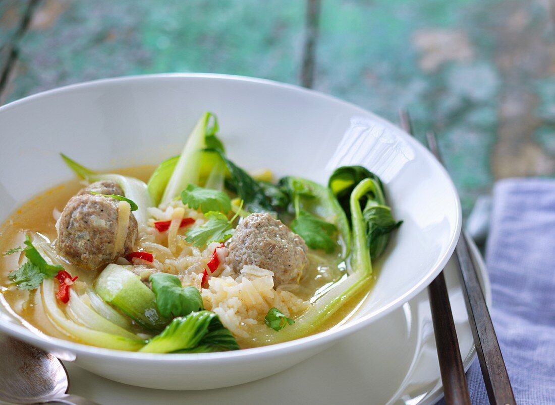 Oriental soup with bok choy, rice and beef meatballs