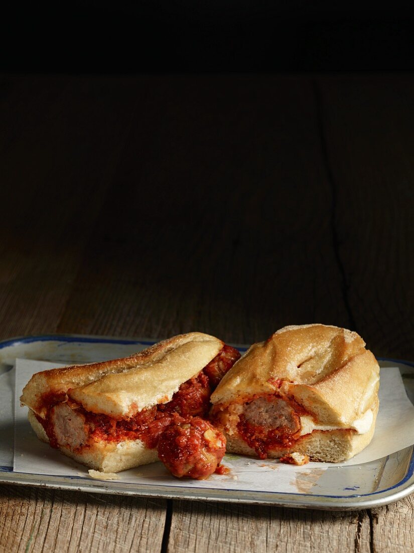 A meatball sub with tomato sauce
