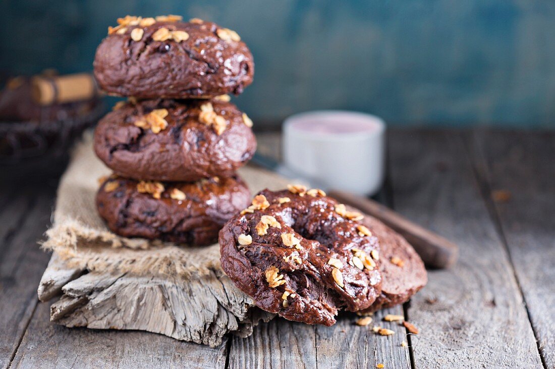 Homemade chocolate bagels on a rustic wooden surface