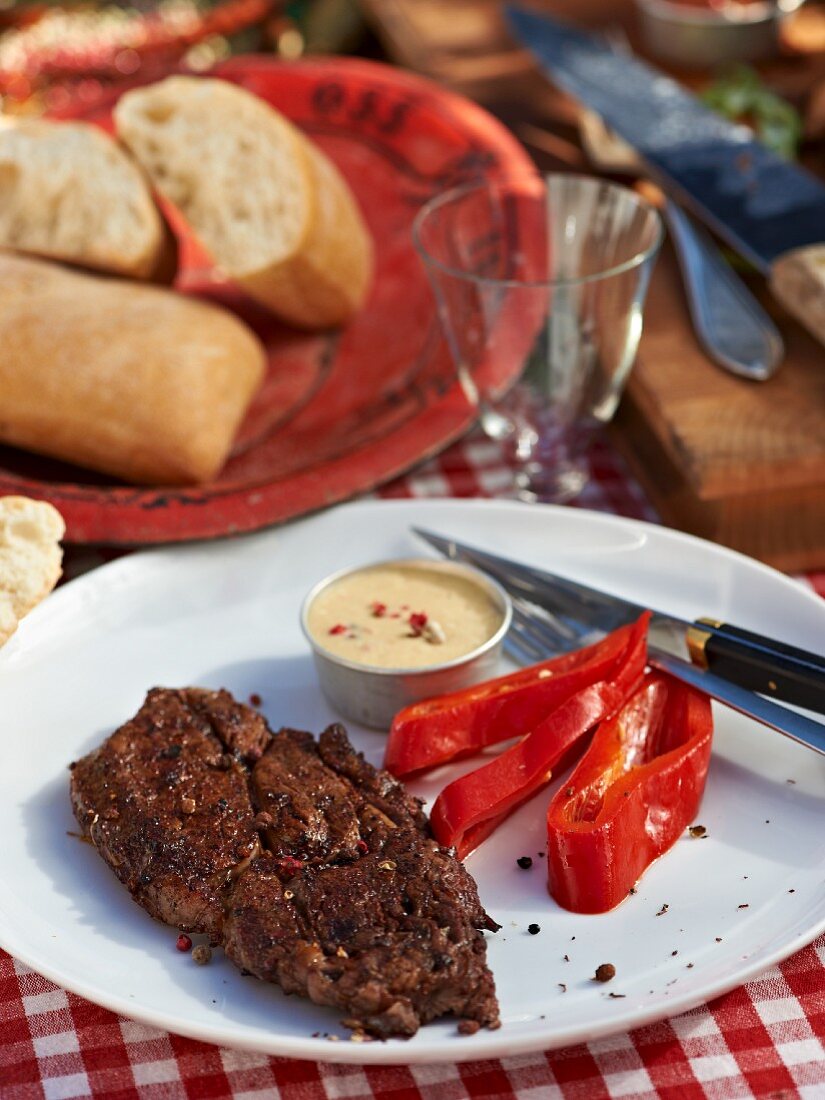 Grilled beef steak with pink pepper