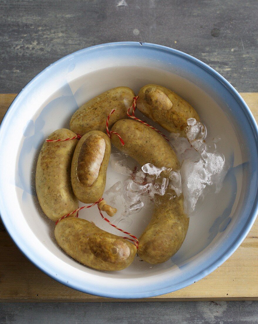 Sausages in a bowl of iced water