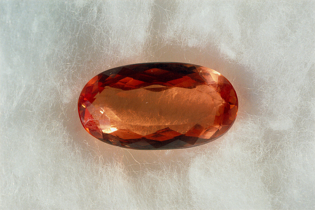 Cut and polished crystal of imperial topaz