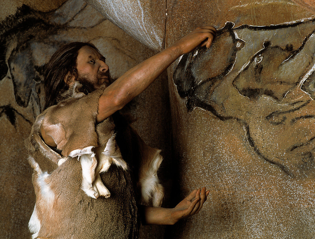 Model of a Cro-Magnon man doing a cave painting