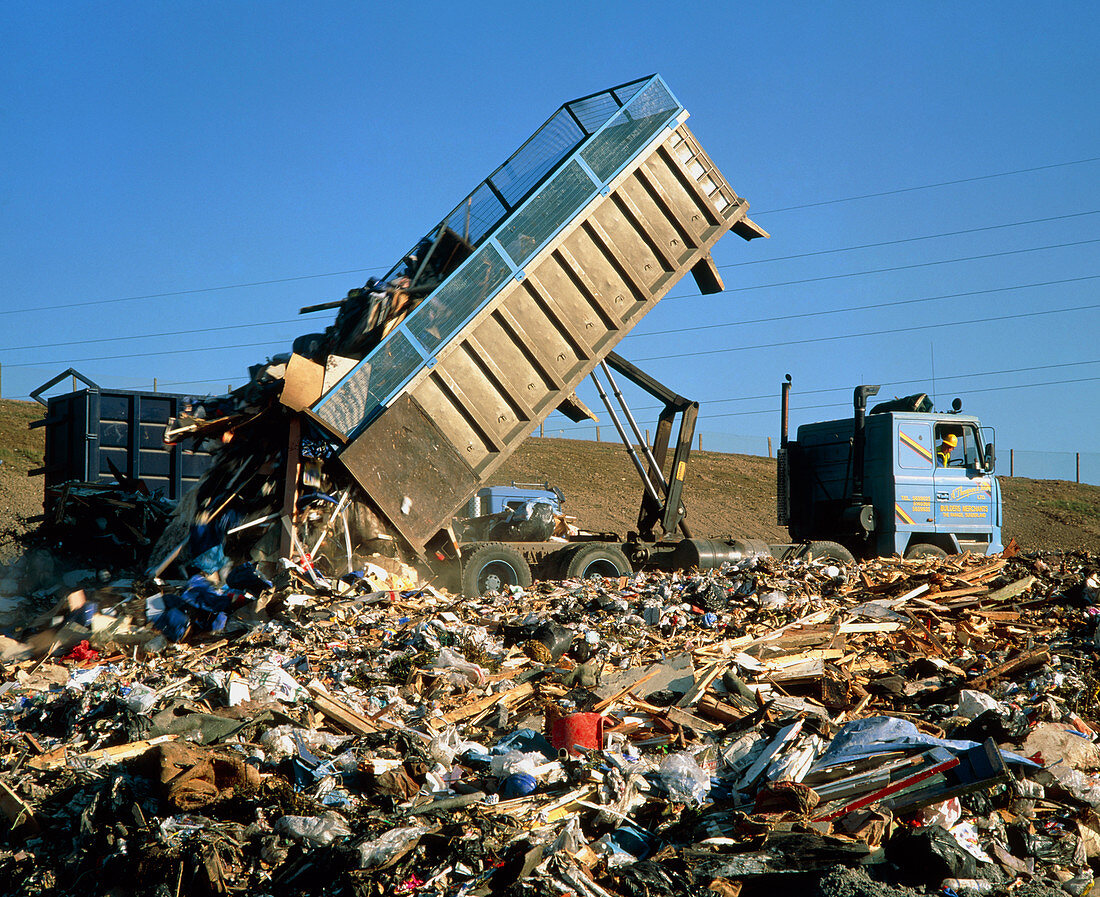 Landfill site with truck dumping refuse