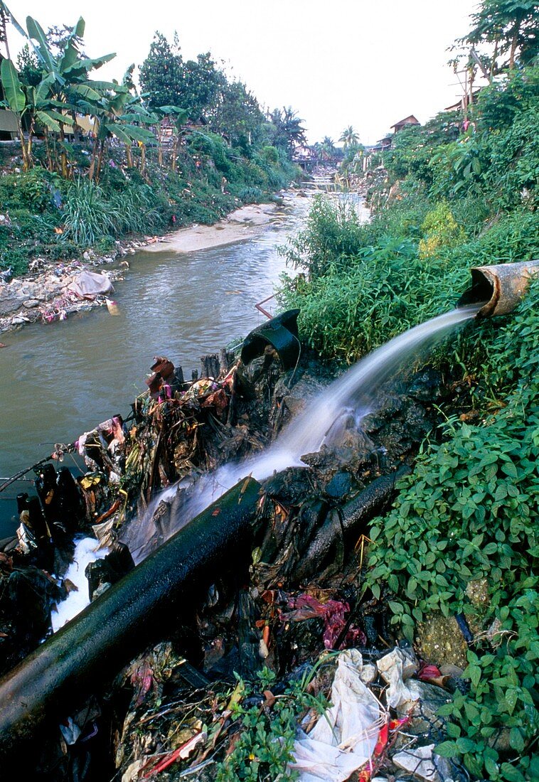 Sewage outflow pipe polluting a river in Malaysia