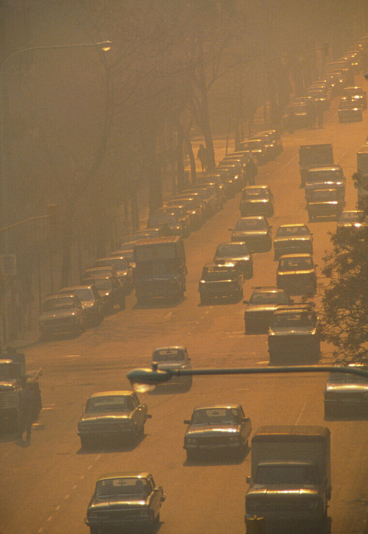 Smog over busy street in city of Buenos Aires