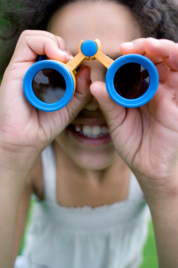 Girl using binoculars