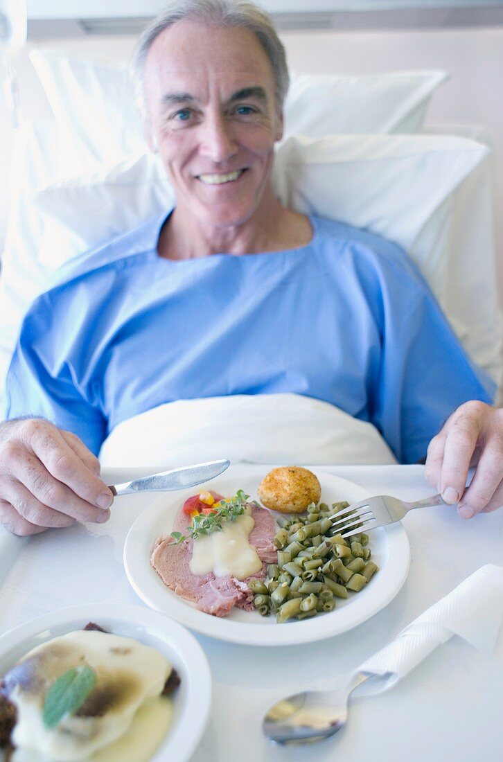 Senior patient eating a hospital meal