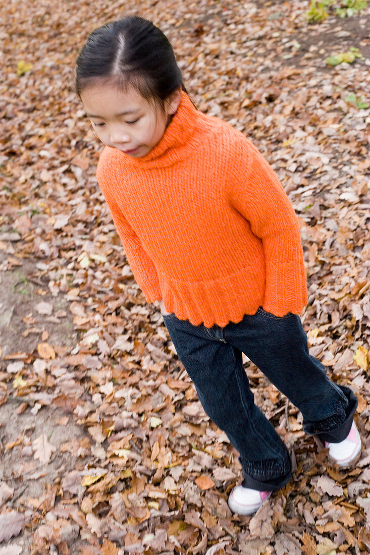 Girl walking in a wood