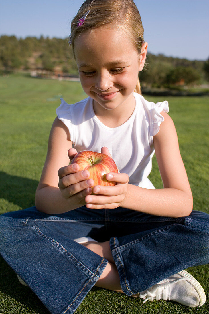 Girl holding an apple