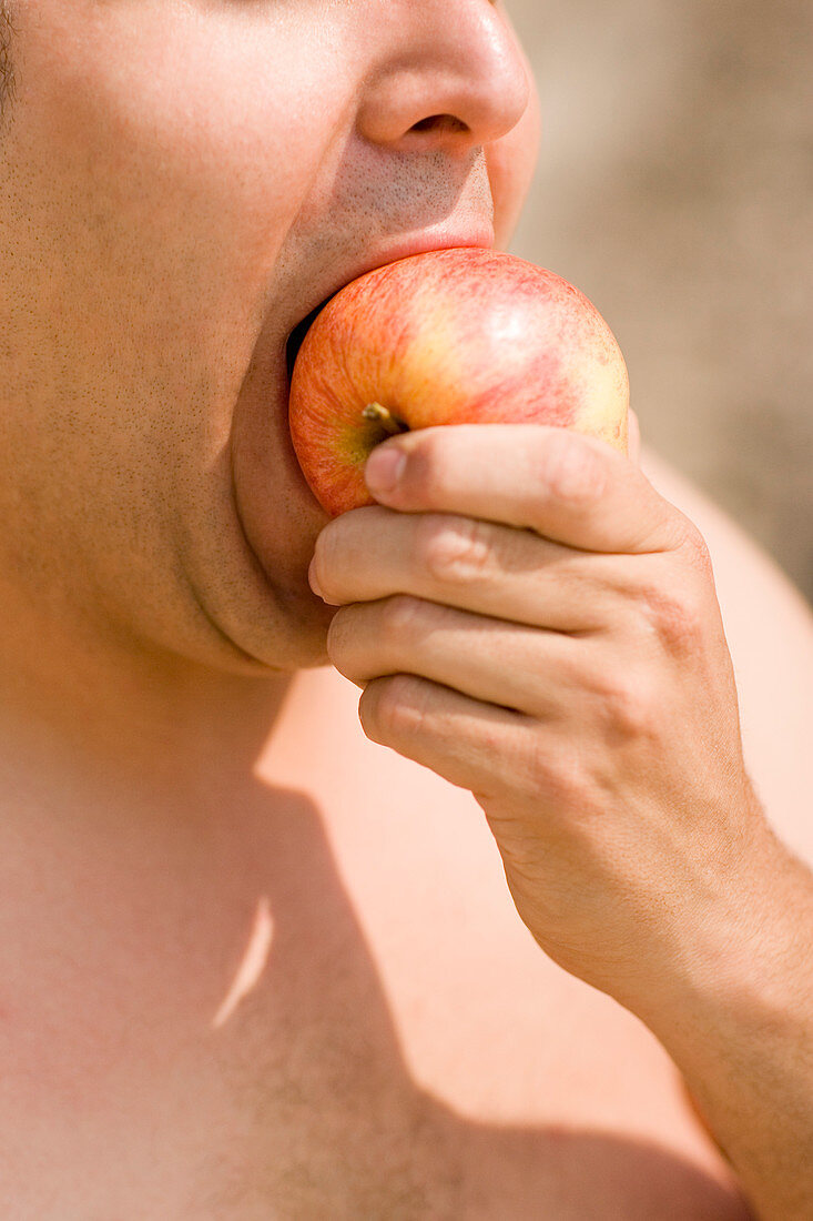 Man eating an apple