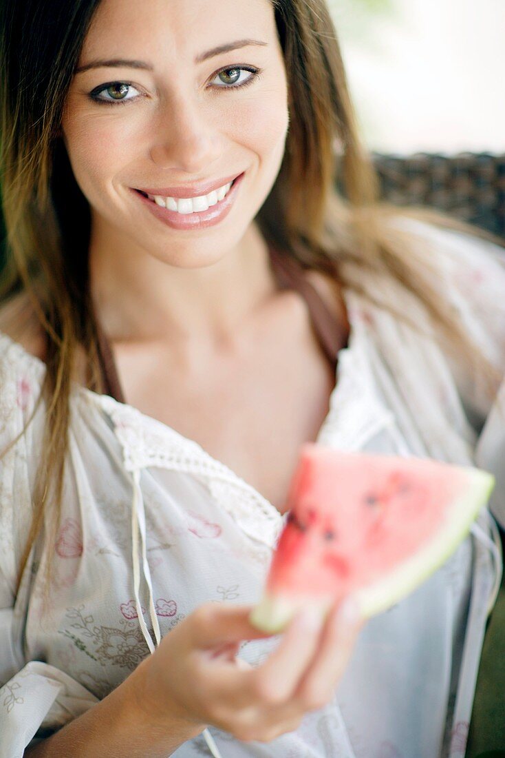 Woman eating watermelon