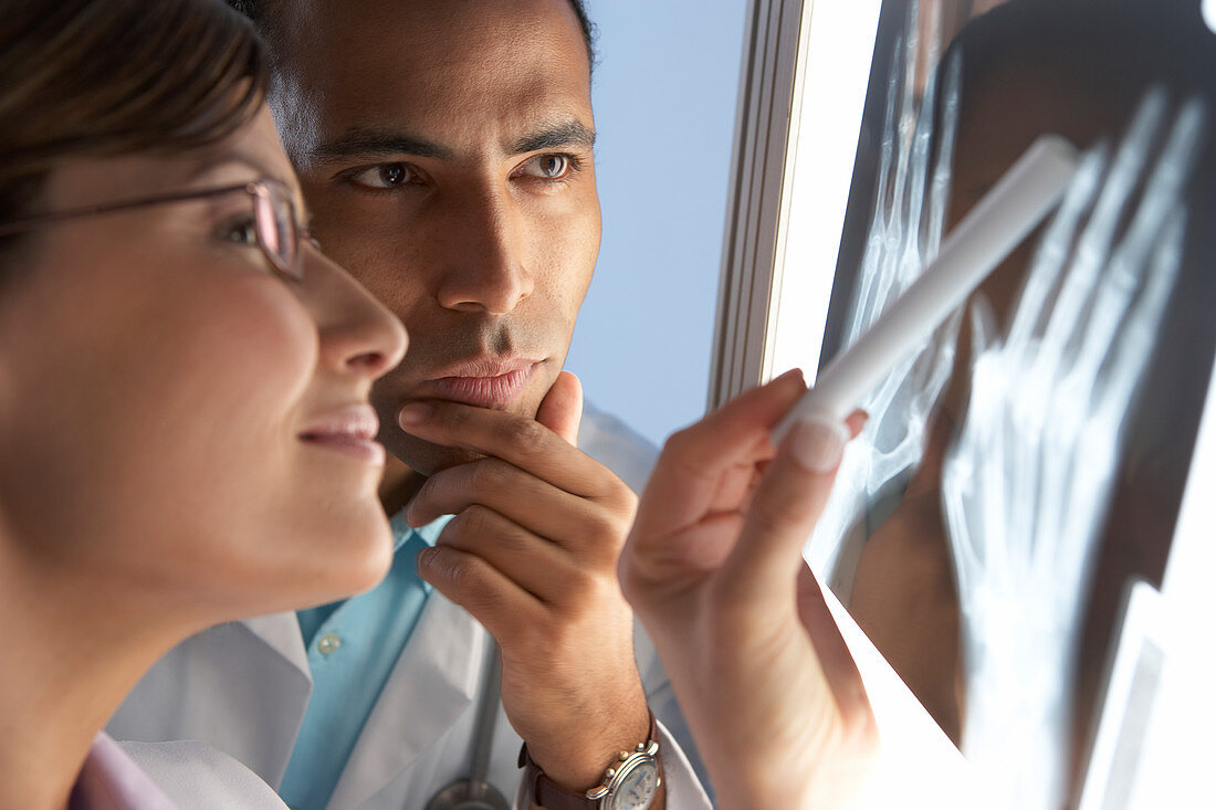 Radiologists examining an X-ray