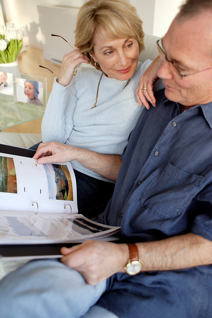 Couple looking at photographs